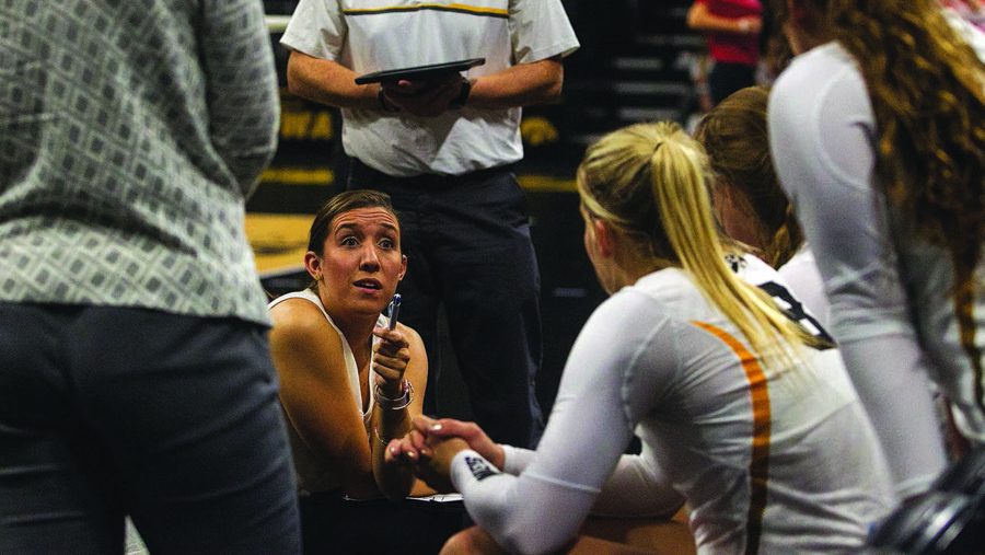 Iowa assistant coach Bre Payton talks to the Iowa players in a time out during a volleyball match at the Carver-Hawkeye Arena in Iowa City on Saturday, Oct 8, 2016. Iowa defeated Indiana 3-0. (The Daily Iowan/Ting Xuan Tan)