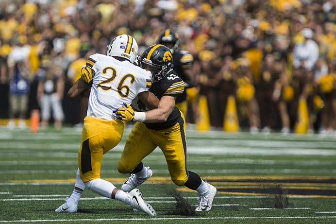 Iowas Josey Jewell tackles Wyomings Avante Cox during the season opener against Wyoming on Saturday, Sep. 2. The Hawkeyes went on to defeat the Cowboys, 24-3. (Ben Smith/The Daily Iowan)