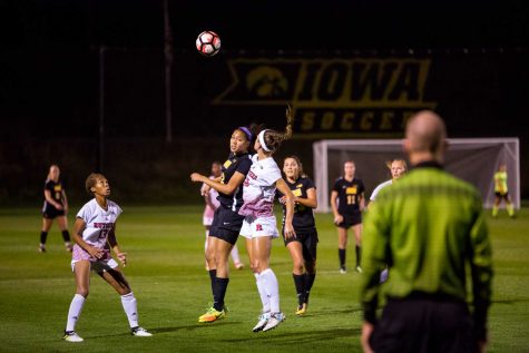 Players try and head the ball during the Iowa/Rutgers soccer game on Thursday, Oct. 5, 2017. Iowa won the match 1-0. (David Harmantas/The Daily Iowan)