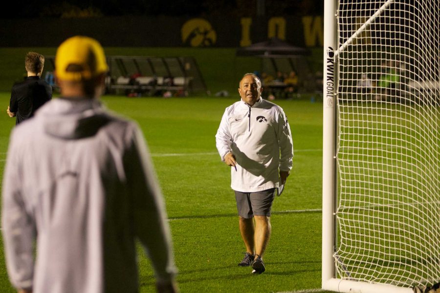 Coach Dave Diiani talks to assistant coach Rade Tanaskovic on the walk in to the locker room at the Iowa Soccer Complex in Iowa City on Saturday, October 21, 2017. The Hawkeyes fell to the Badgers 3-0 (Paxton Corey/The Daily Iowan)