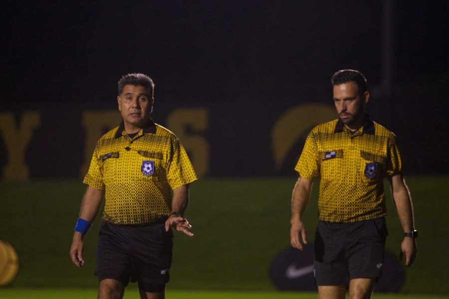 Referees converse at half time at the Iowa Soccer Complex in Iowa City on Saturday, October 21, 2017. The Hawkeyes fell to the Badgers 3-0 (Paxton Corey/The Daily Iowan)