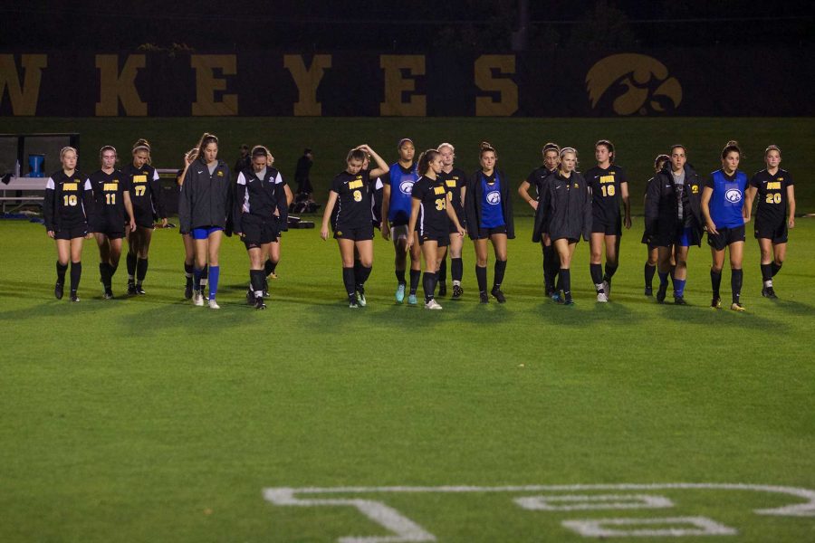 An somber Iowa Soccer team comes to the sideline to thank the fans at the Iowa Soccer Complex in Iowa City on Saturday, October 21, 2017. The Hawkeyes fell to the Badgers 3-0. (Paxton Corey/The Daily Iowan)