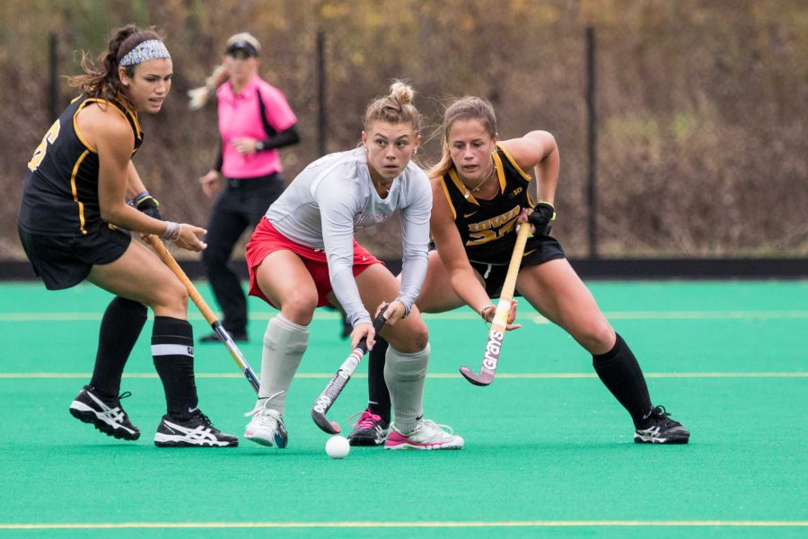 Iowa's Mallory Lefkowitz (left) and Sophie Sunderland fight for the ball during the match against the Ohio State Buckeyes on Sunday, Oct. 22, 2017. The Hawkeyes defeated the Buckeyes 1-0. (David Harmantas/The Daily Iowan)