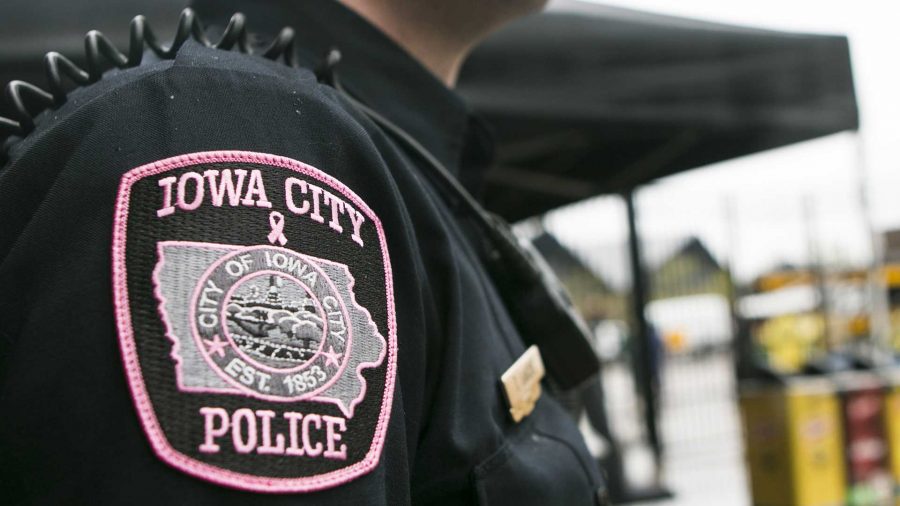 An Iowa City police officer displays a pink patch on Saturday, Oct. 7, 2017. (Joseph Cress/The Daily Iowan)