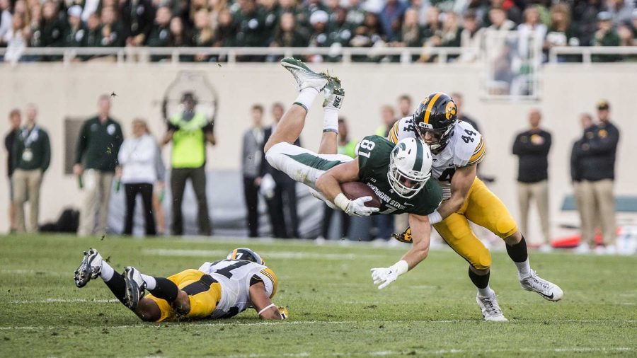 Iowa+linebacker+Ben+Niemann+tackles+Michigan+State+tight+end+Matt+Sokol+during+the+game+between+Iowa+and+Michigan+State+at+Spartan+Stadium+on+Saturday%2C+Sept.+30%2C+2017.+The+Hawkeyes+fell+to+the+Spartans+with+a+final+score+of+10-17.+%28Nick+Rohlman%2FThe+Daily+Iowan%29