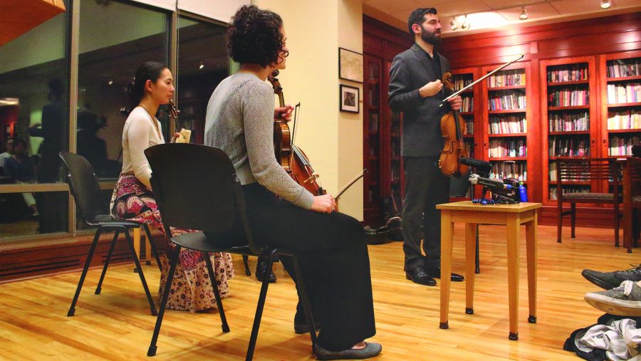 Jonah Sirota introduces the quartet in the Frank Conroy Reading Room of the Dey House on Thursday, Oct. 5, 2017. The Chiara Quartet teamed up with the Iowa Writing Program to create a performance about memory. (Ashley Morris/The Daily Iowan)