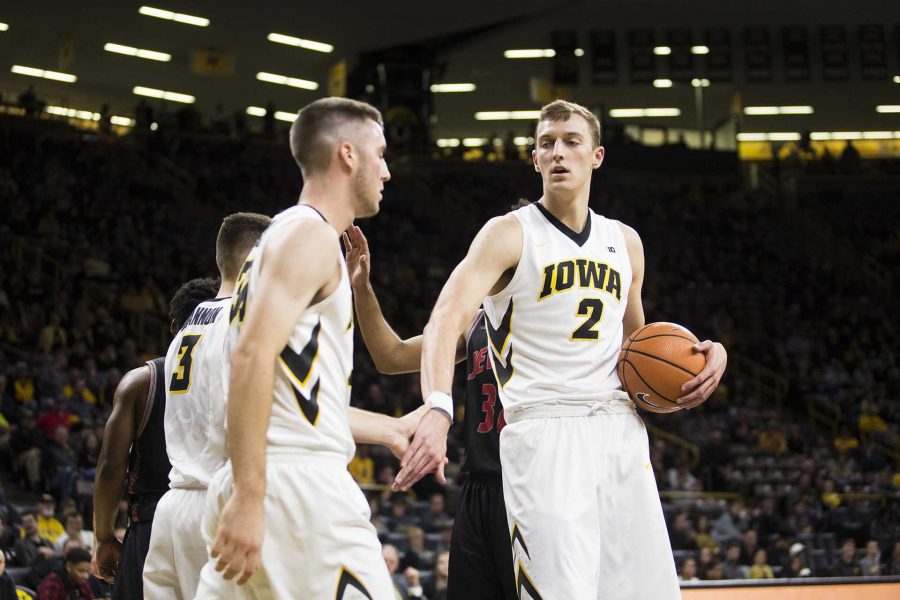 Iowa+forward+Jack+Nunge+slaps+hands+with+teammate+Connor+McCaffery%2C+left%2C+after+drawing+a+foul+during+a+mens+basketball+exhibition+game+between+Iowan+and+William+Jewell+College+in+Carver-Hawkeye+Arena+on+Friday%2C+Oct.+27%2C+2017.+The+Hawkeyes+defeated+the+Cardinals%2C+105-81.+%28Joseph+Cress%2FThe+Daily+Iowan%29