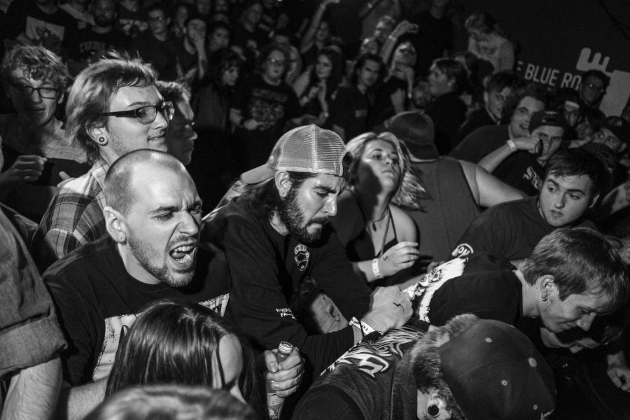 Concertgoers push up against the stage at the front of a mosh pit during a concert at Blue Moose on Saturday October 21, 2017. The show was headlined by the hardcore punk band Knocked Loose. (Nick Rohlman/The Daily Iowan)