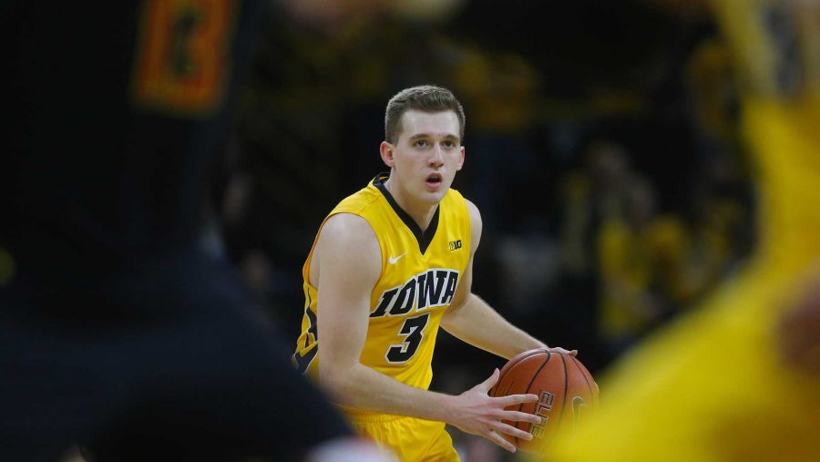 Iowa guard Jordan Bohannon looks for an open teammate during the game between Iowa and Maryland at Carver Hawkeye on Thursday, January 19, 2017. The Hawkeyes made a strong second half push but came up short to the Terrapins by the final score of 84-76. (The Daily Iowan/File photo)