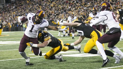 Minnesota running back Rodney Smith gets tackled by Iowa linebacker Josey Jewell and Jake Gervase during an Iowa/Minnesota football game in Kinnick Stadium on Saturday, Oct. 28, 2017. The Hawkeyes defeated the Golden Gophers, 17-10. 