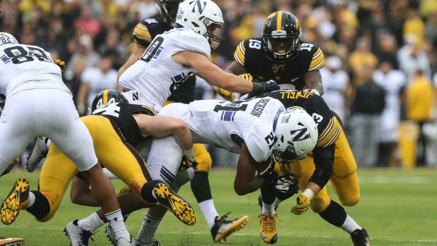 Northwestern running back Justin Jackson crashes into Iowa outside linebacker Josey Jewell during the Iowa v. Northwestern game at Kinnick Stadium on Saturday, Oct. 1, 2016. The Hawkeyes fell to the Wildcats 38-31. (The Daily Iowan/Anthony Vazquez)