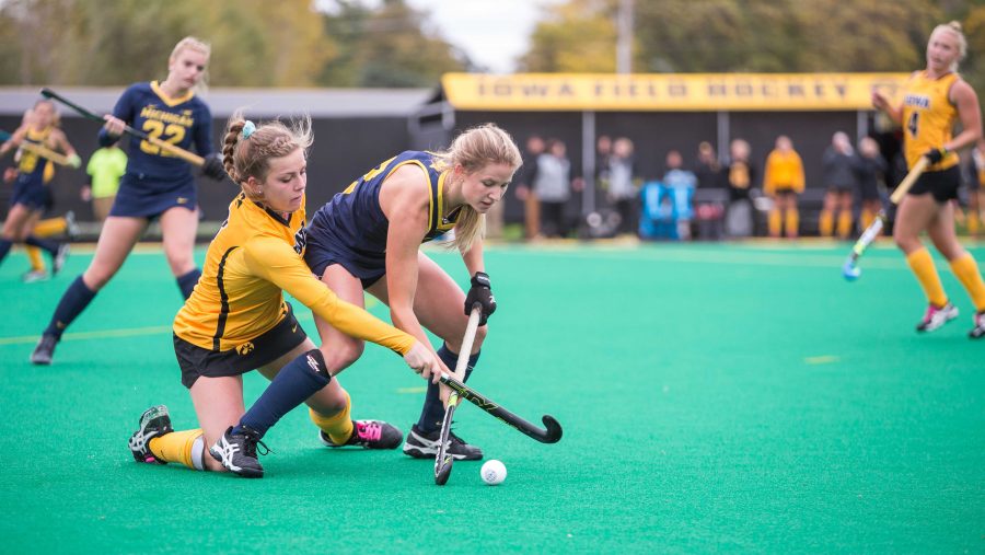 Iowa field hockey midfielder Nikki Freeman fights for the ball during a match against the Michigan Wolverines on Sunday, Oct. 15, 2017.  The Wolverines defeated the Hawkeyes 3-2. (David Harmantas/The Daily Iowan)