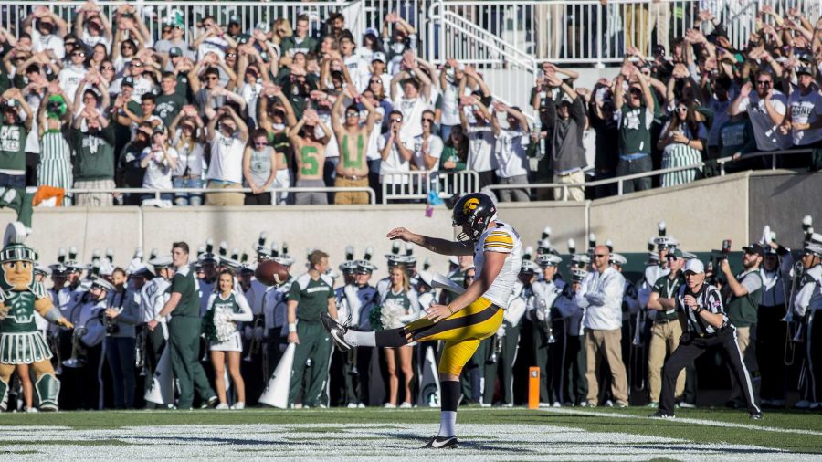 Iowa punter Colten Rastetter punts out of Iowa's end zone as the MSU student section provides words of encouragement during the game between Iowa and Michigan State at Spartan Stadium on Saturday Sept. 30, 2017. The Spartans defeated the Hawkeyes 17-10. (Nick Rohlman/The Daily Iowan)