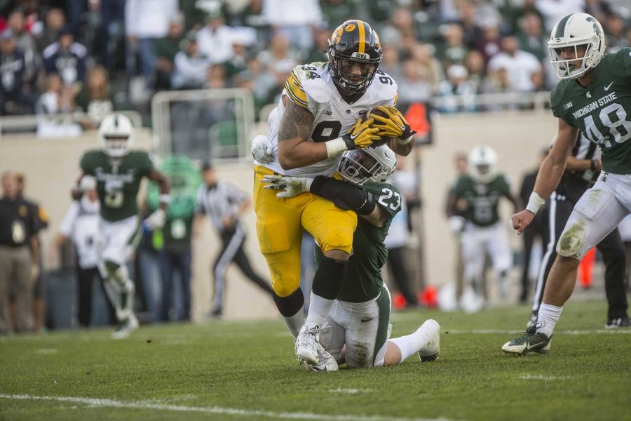 Iowa defensive end AJ Espensa runs after making a catch on a fake field goal play during the game between Iowa and Michigan State at Spartan Stadium on Saturday Sept. 30, 2017. The Spartans defeated the Hawkeyes 17-10. (Nick Rohlman/The Daily Iowan)