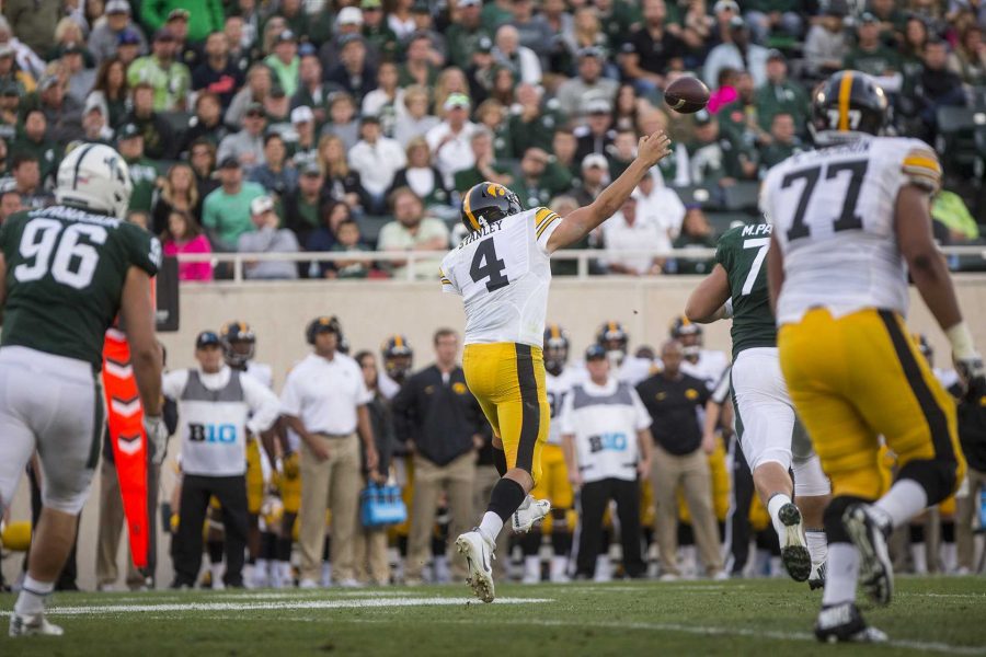 Iowa quarterback Nate Stanley throws on the run during the game between Iowa and Michigan State at Spartan Stadium on Saturday Sept. 30, 2017. The Spartans defeated the Hawkeyes 17-10. (Nick Rohlman/The Daily Iowan)