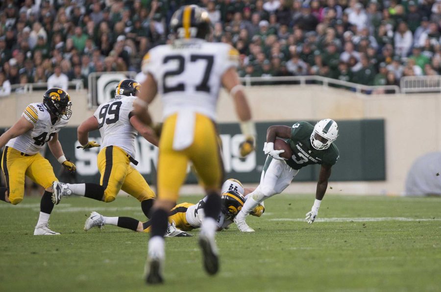 Michigan State running back LJ Scott runs the ball during the game between Iowa and Michigan State at Spartan Stadium on Saturday Sept. 30, 2017. The Spartans defeated the Hawkeyes 17-10. (Nick Rohlman/The Daily Iowan)