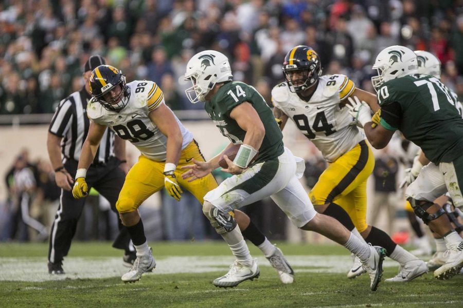 Michigan State quarterback Brian Lewerke runs the ball during the game between Iowa and Michigan State at Spartan Stadium on Saturday Sept. 30, 2017. The Spartans defeated the Hawkeyes 17-10. (Nick Rohlman/The Daily Iowan)