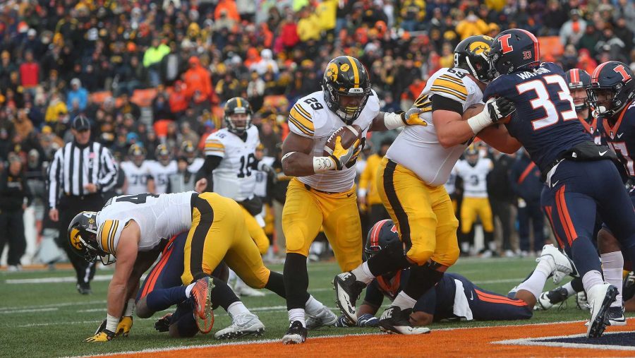 Iowa running back LeShun Daniels, Jr. runs in for a 1-yard touchdown during the Iowa-Illinois game in Memorial Stadium in Champaign on Saturday, Nov. 19, 2016. The Hawkeyes defeated the Fighting Illini, 28-0. (The Daily Iowan/Margaret Kispert)