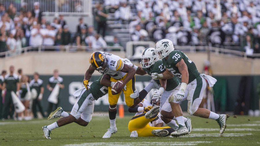 Iowa reciever Brandon Smith fumbles during the game between Iowa and Michigan State at Spartan Stadium on Saturday Sept. 30, 2017. The Spartans defeated the Hawkeyes 17-10. (Nick Rohlman/The Daily Iowan)