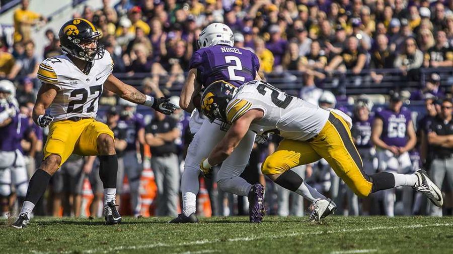 Iowa+outside+linebacker+Kevin+Ward+%2826%29+tackles+Northwesterns+Flynn+Nagel+%282%29+during+the+game+between+Iowa+and+Northwestern+at+Ryan+Field+in+Evanston%2C+Ill.+on+Saturday%2C+Oct.+21%2C+2017.+Iowas+Amani+Hooker+%2827%29+assists+in+the+tackle.+The+Wildcats+defeated+the+Hawkeyes+17-10+in+overtime.+%28Ben+Smith%2FThe+Daily+Iowan%29