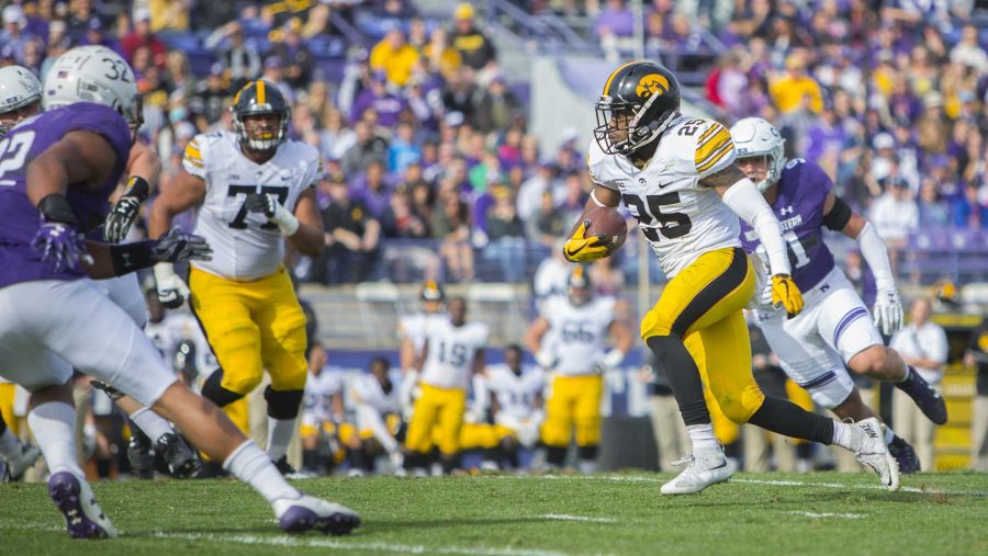 Iowa running back Akrum Wadley runs during the game between Iowa and Northwestern at Ryan Field in Evanston on Saturday, Oct. 21, 2017. The wildcats defeated the Hawkeyes, 17-10, in overtime. (Lily Smith/The Daily Iowan)