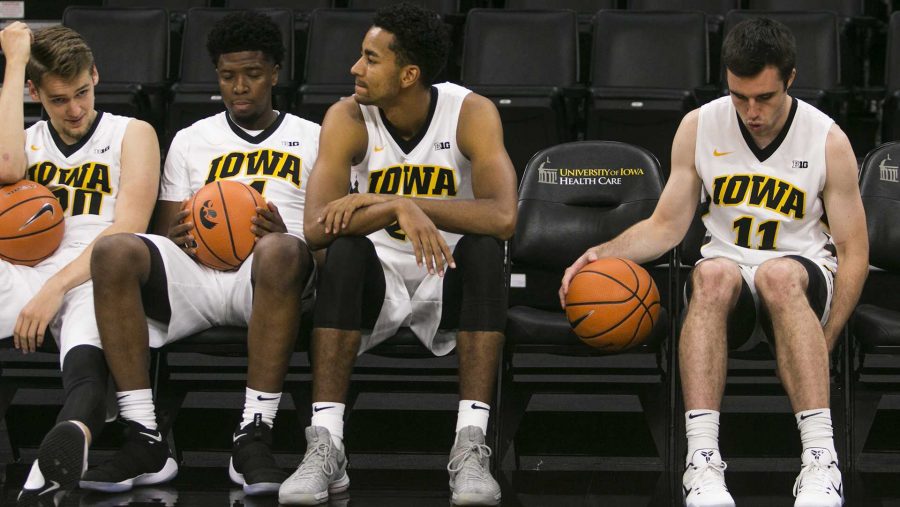 Iowas Riley Till, Isaiah Moss, Dom Uhl, and Charlie Rose, relax on the bench during mens basketball media day in Carver-Hawkeye Arena on Monday, Oct. 16, 2017. The Hawkeyes open up their season with an exhibition game against William Jewell College on Friday, Oct. 27. at 7 p.m. in Carver. (Joseph Cress/The Daily Iowan)