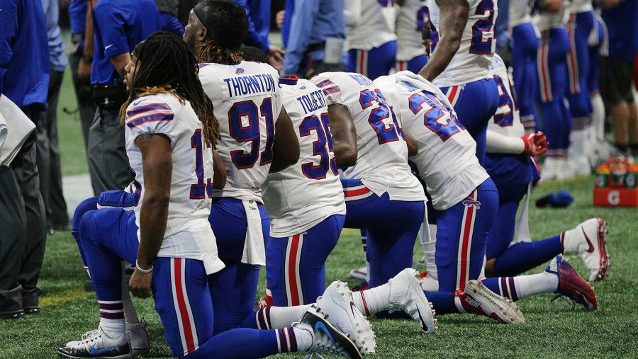 Many of the Buffalo Bill players kneel on the sidelines for the national anthem before the game with the Atlanta Falcons in the land of the free on Oct. 1, 2017 in Atlanta. (Curtis Compton/Atlanta Journal-Constitution/TNS)
