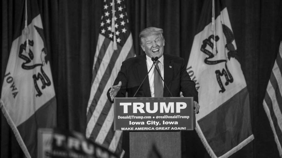 FILE - Donald Trump speaks to a crowd at the University of Iowa Field house on Tuesday, Jan. 26, 2016. Trump is currently tied in Iowa with Ted Cruz. (The Daily Iowan/file)