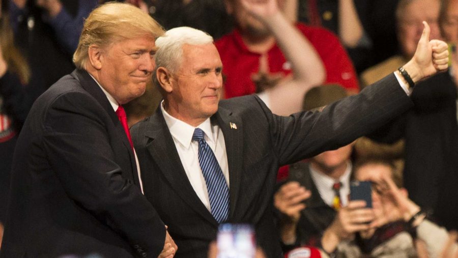 President-Elect Donald J. Trump and Vice President-Elect Mike Pence shake hands during an event in Des Moines on Thursday, Dec. 8, 2016. (The Daily Iowan/Joseph Cress)