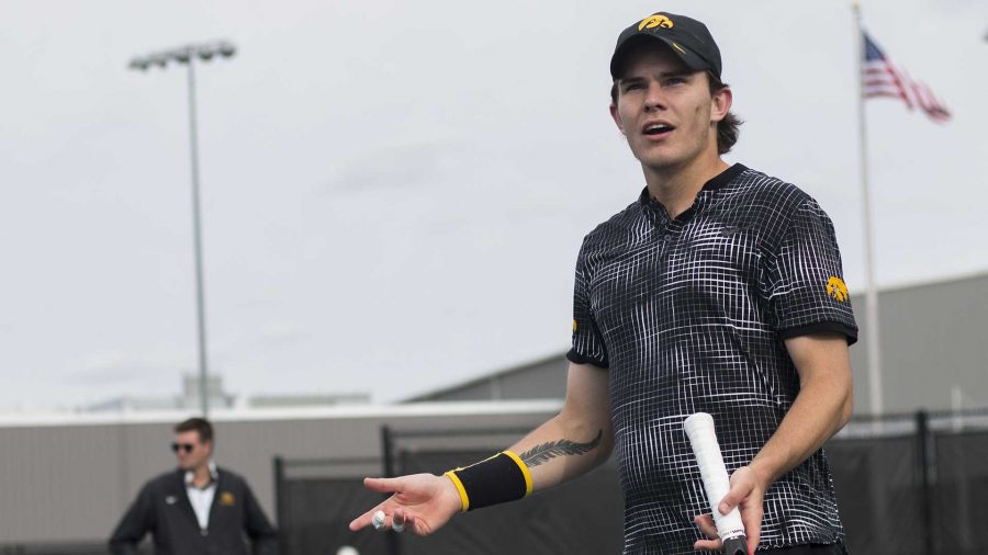 Iowas Jonas Larsen reacts to a call during an Iowa-Michigan mens tennis match outside at the Hawkeye Tennis and Recreation Complex on Friday, April 21, 2017. The No. 16 Wolverines defeated the Hawkeyes, 5-2. (The Daily Iowan/Joseph Cress)