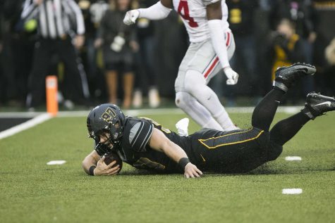 Iowa long snapper Tyler Kluver makes a reception off of a trick play on fourth down during the Iowa/Ohio State football game in Kinnick Stadium on Saturday, Nov. 4, 2017. 
