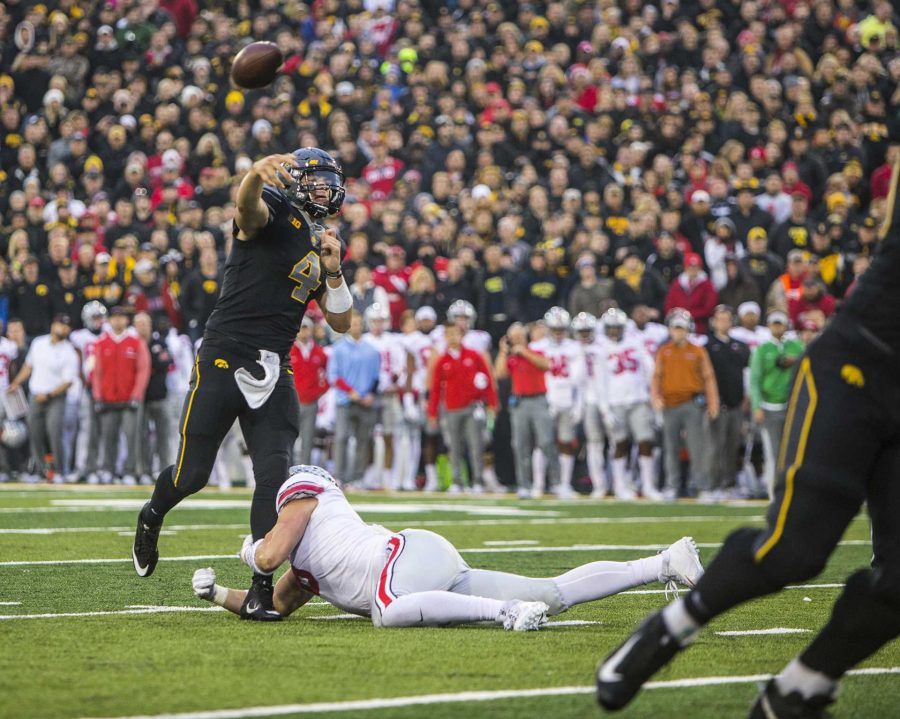 Iowa+quarterback+Nate+Stanley+throws+a+touchdown+pass+during+Iowas+game+against+Ohio+State+at+Kinnick+Stadium+on+Saturday%2C+Nov.+4%2C+2017.+The+Hawkeyes+defeated+the+Buckeyes+55+to+24.+%28Nick+Rohlman%2FThe+Daily+Iowan%29