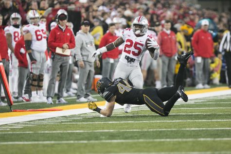 Iowa linebacker Ben Niemann trips up Ohio State running back Mike Weber during the Iowa/Ohio State football game in Kinnick Stadium on Saturday, Nov. 4, 2017. The Hawkeyes defeated the Buckeyes in a storming fashion, 55-24. (Joseph Cress/The Daily Iowan)