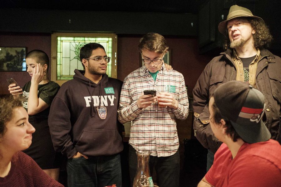 Ryan Hall and supporters react to election results at the Mill in Iowa City on Tuesday, Nov. 7, 2017. Hall lost Iowa City city council district B to incumbent Susan Mims. (Nick Rohlman/The Daily Iowan)