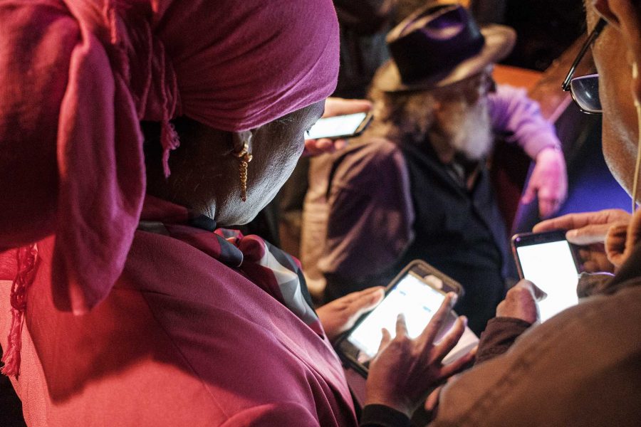 Mazahir Salih checks election results online at the Mill in Iowa City on Tuesday, Nov. 7, 2017. Salih won an at large seat on the Iowa City city council along with incumbent Kingsley Botchway. (Nick Rohlman/The Daily Iowan)