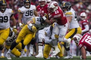 Wisconsin running back Jonathan Taylor (23) is tackled by Iowa linebacker Ben Niemann (44) just before the goal line during the game between Iowa and Wisconsin at Camp Randall Stadium on Saturday, Nov. 11, 2017. The Hawkeyes fell to the Badgers 38-14. (Ben Smith/The Daily Iowan)