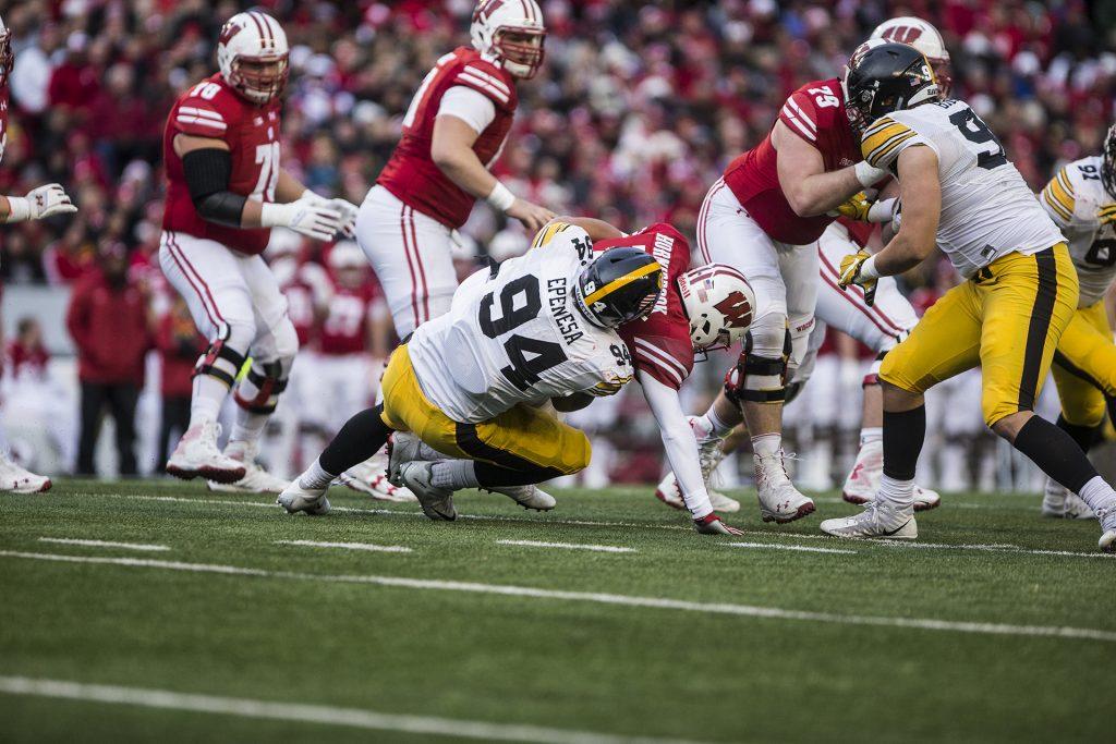 Iowa defensive end A.J. Epenesa (94) sacks Wisconsin quarterback Alex Hornibrook (12) during the game between Iowa and Wisconsin at Camp Randall Stadium on Saturday, Nov. 11, 2017. The Hawkeyes fell to the Badgers 38-14. 