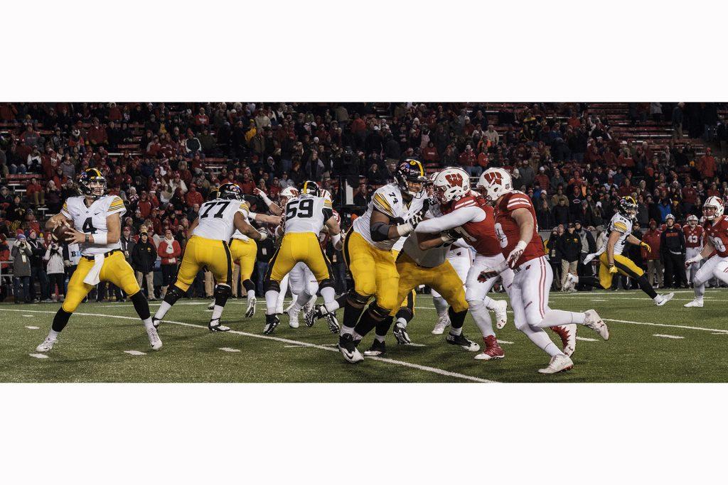 Iowa quarterback Nate Stanley drops back to pass during Iowa's game against Wisconsin at Camp Randall Stadium on Saturday, Nov. 11, 2017. The badgers defeated the Hawkeyes 38-14. (Nick Rohlman/The Daily Iowan)