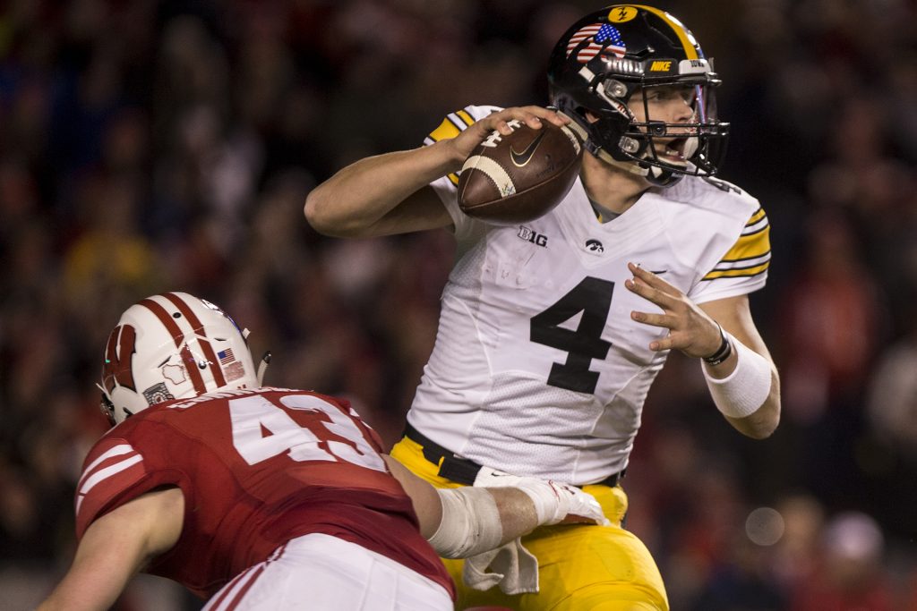 Iowa quarterback Nate Stanley attempts to avoid the blitz during Iowas game against Wisconsin at Camp Randall Stadium on Saturday, Nov. 11, 2017. The badgers defeated the Hawkeyes 38-14. (Nick Rohlman/The Daily Iowan)