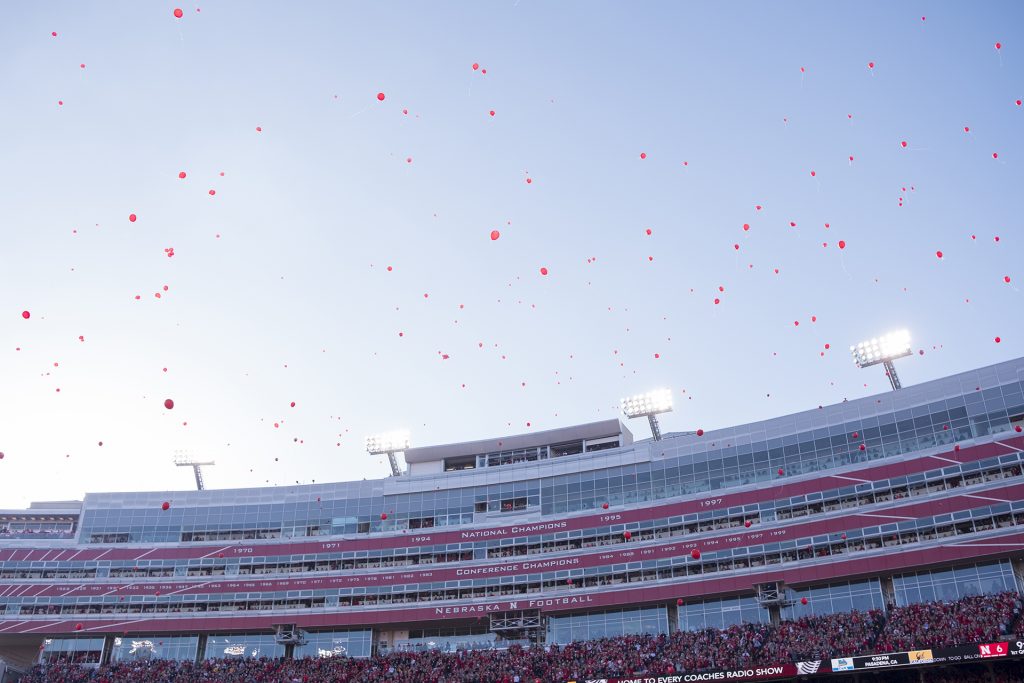 Nebraska fans release balloons to celebrate their team's first touchdown during Iowa's game against Nebraska at Memorial Stadium on Friday, Nov. 24th, 2017. The Hawkeyes defeated the Cornhuskers 56-14. (Nick Rohlman/The Daily Iowan)