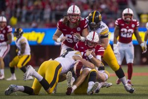 Nebraska quarterback Tanner Lee is sacked by Iowa defensive ends Parker Hesse and Anthony Nelson during Iowas game against Nebraska at Memorial Stadium on Friday, Nov. 24, 2017. The Hawkeyes defeated the Cornhuskers 56-14. 