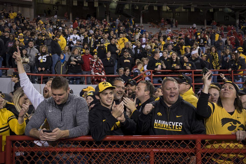 Iowa fans celebrate after Iowa's game against Nebraska at Memorial Stadium on Friday, Nov. 24th, 2017. The Hawkeyes defeated the Cornhuskers 56-14. (Nick Rohlman/The Daily Iowan)