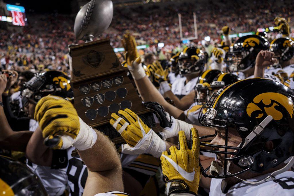 Iowa+players+lift+the+Heros+trophy+after+Iowas+game+against+Nebraska+at+Memorial+Stadium+on+Friday%2C+Nov.+24th%2C+2017.+The+Hawkeyes+defeated+the+Cornhuskers+56-14.+%28Nick+Rohlman%2FThe+Daily+Iowan%29