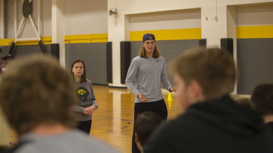 From left: UI students Mellisa McLihon and Ben Flaherty speaks at the Big Brothers Big Sisters soccer game in the Fieldhouse on Sunday, Nov. 5, 2017. (Lily Smith/The Daily Iowan)