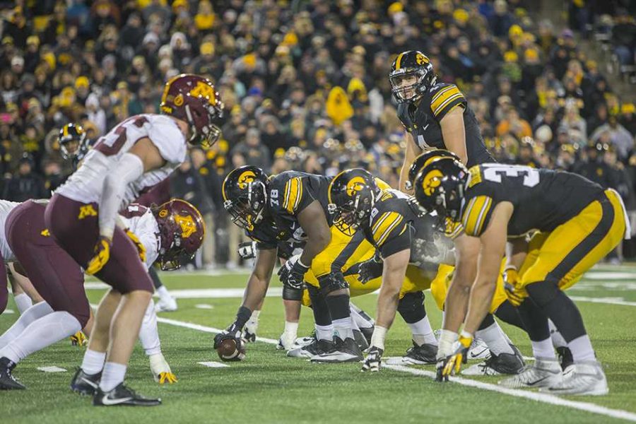 Iowa offense prepares for the snap during the Iowa/Minnesota football game at Kinnick Stadium on Saturday, Oct. 28, 2017. The Hawkeyes defeated the Golden Gophers, 17-10, to keep the Floyd of Rosedale trophy. (Lily Smith/The Daily Iowan)