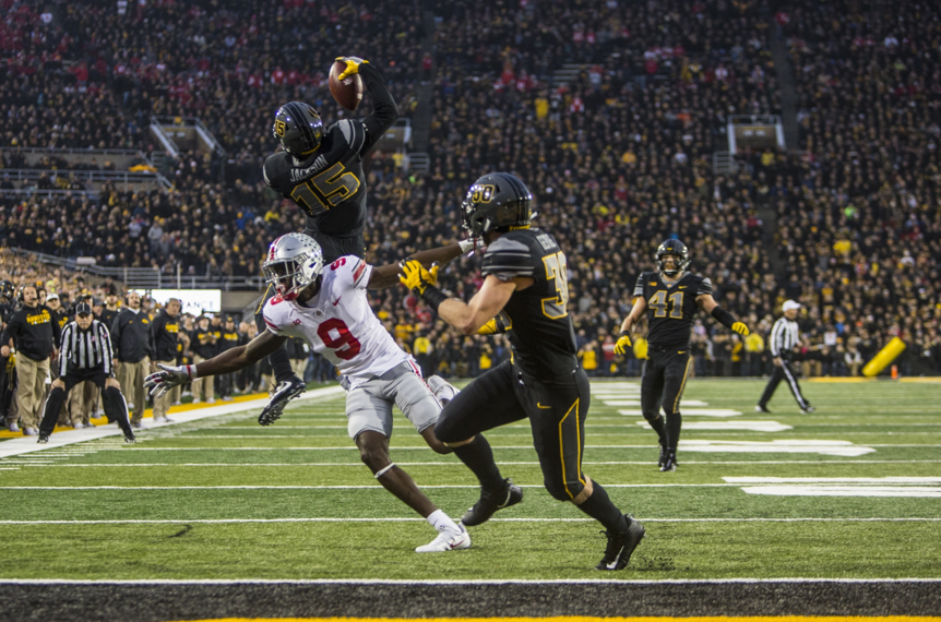 Iowa cornerback Josh Jackson makes a jumping one-handed interception during Iowas game against Ohio State at Kinnick Stadium on Saturday, Nov. 4, 2017. Jackson made three interceptions on the day as the Hawkeyes defeated the Buckeyes 55 to 24. (Nick Rohlman/The Daily Iowan)