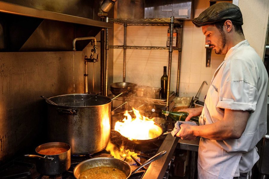 Michael Mills, a chef at Baroncini's, works in the Kitchen on Wednesday, Nov. 1, 2017. Mills has worked in the Kitchen at Baroncini's for four years and is working at the restaurant for the second time. (Nick Rohlman/The Daily Iowan)