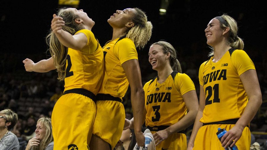 Iowas+Kathleen+Doyle+%2822%29+and+Chase+Coley+%284%29+celebrate+a+victory+over+Minnesota+State-Moorhead+at+Carver-Hawkeye+Arena+on+Sunday%2C+Nov.+5%2C+2017.+The+Hawkeyes+beat+the+Dragons+85-56.+%28Ben+Smith%2FThe+Daily+Iowan%29