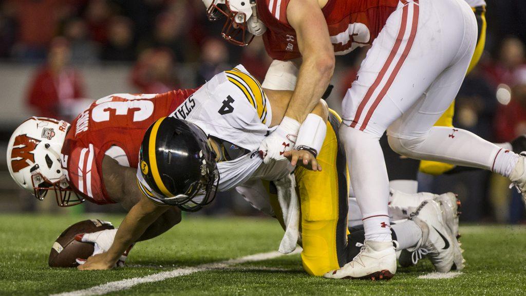 Iowa+quarterback+Nate+Stanley+is+hit+after+fumbling+the+ball+during+Iowas+game+against+Wisconsin+at+Camp+Randall+Stadium+on+Saturday%2C+Nov.+11%2C+2017.+The+badgers+defeated+the+Hawkeyes+38-14.+%28Nick+Rohlman%2FThe+Daily+Iowan%29