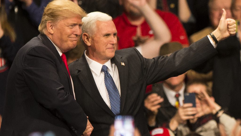 FILE - President-Elect Donald J. Trump and Vice President-Elect Mike Pence shake hands during an event in Des Moines on Thursday, Dec. 8, 2016. Trump and Pence are completing a Thank You tour across the country. (The Daily Iowan/Joseph Cress)